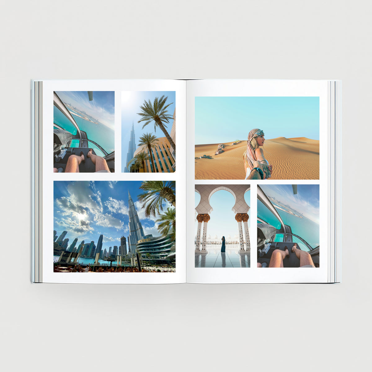 Open personalised travel photo book with printed holiday photos and clean page layouts.